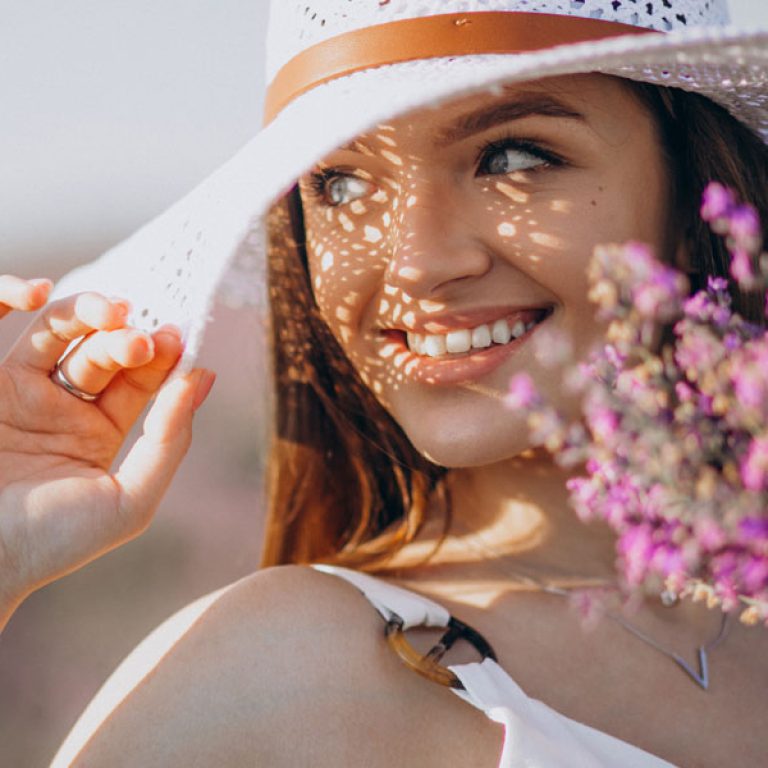 Beautiful woman in white dress in a lavander field